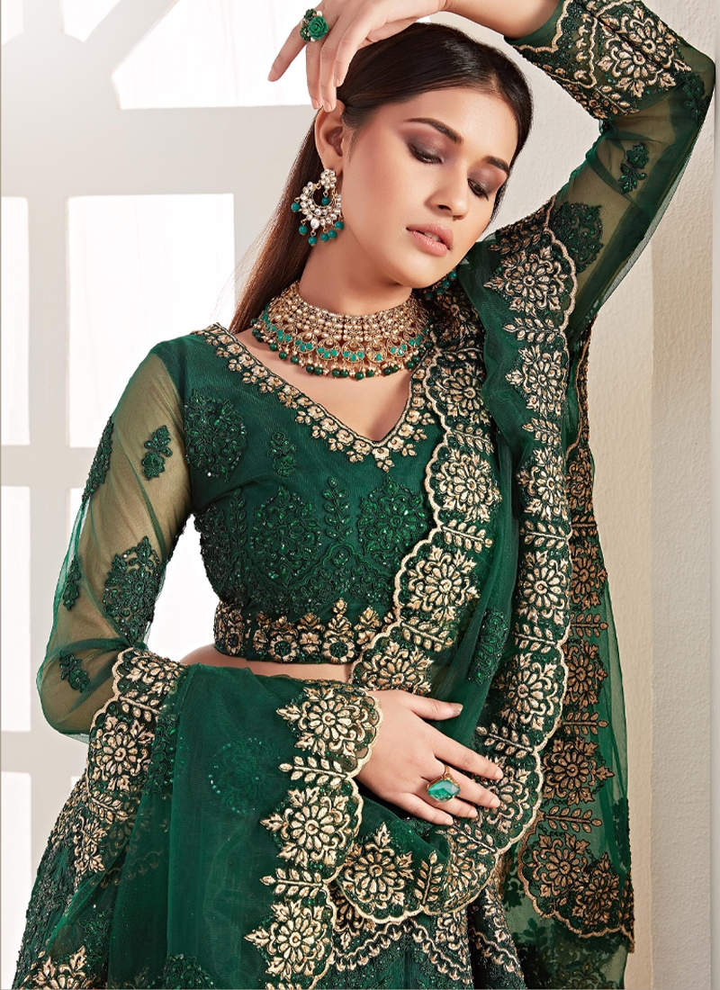 Heavy embroidered net lehenga in Green