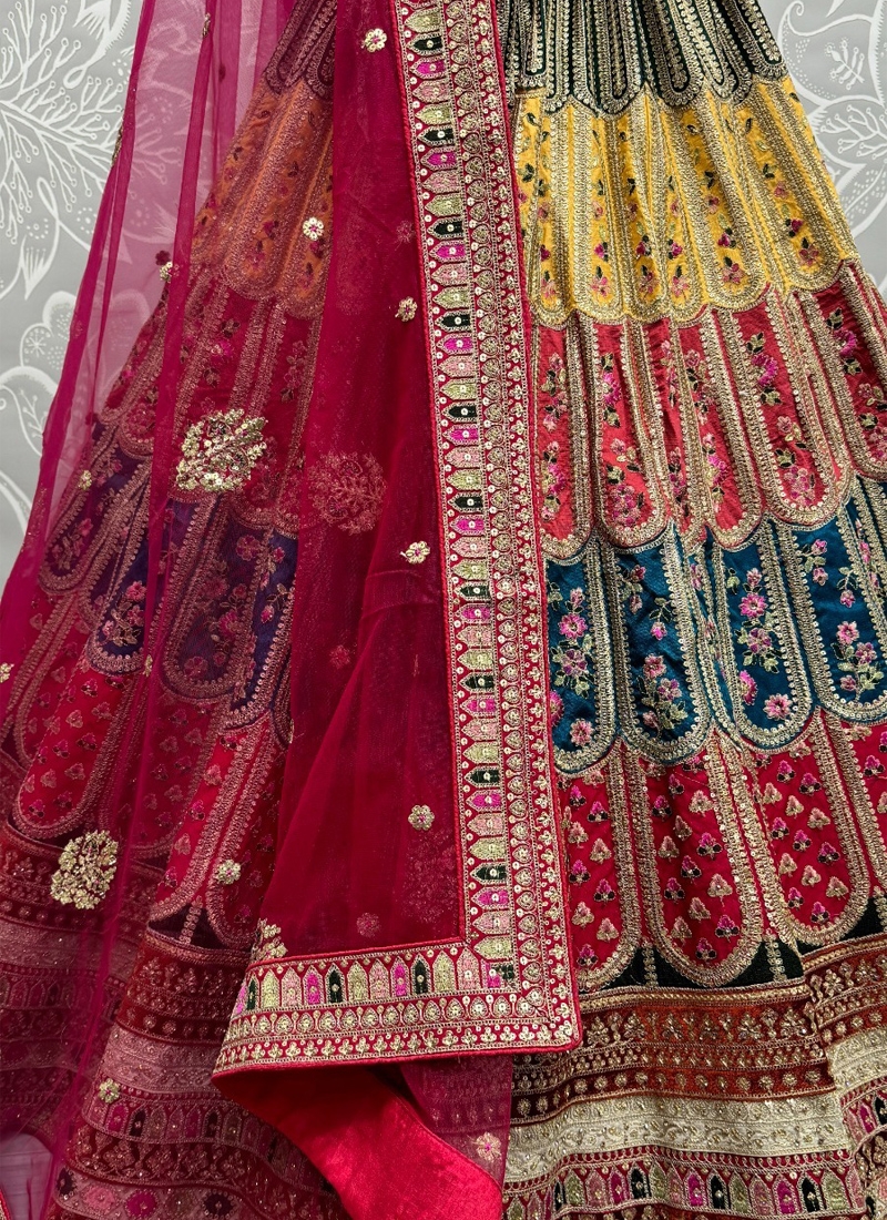 Soft net lehenga with colorful patches and thread embroidery in maroon