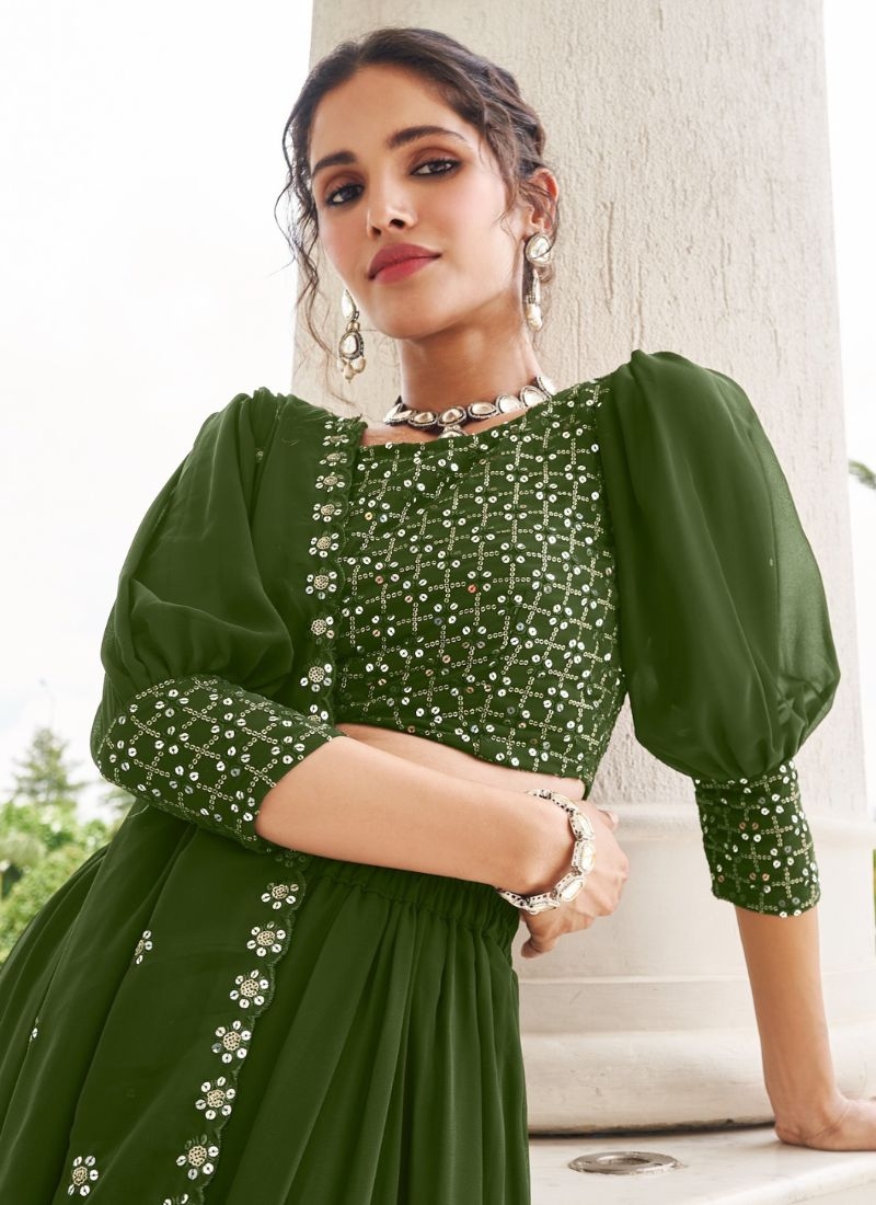 Trendy georgette lehenga with embroidered sleeve less blouse in dark green