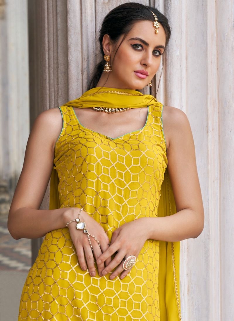 Exquisite heavy flare embroidered sharara suit in yellow