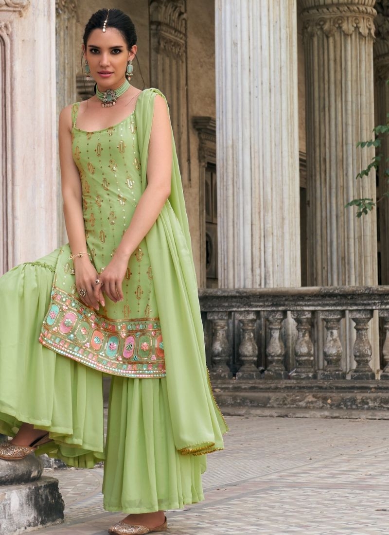 Exquisite heavy flare embroidered sharara suit in light green