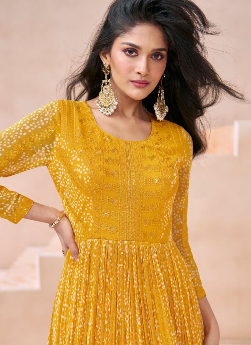 Trendy embroidered anarkali suit with net dupatta in yellow