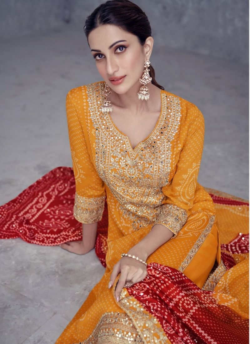 Stunning embroidered palazzo suit with printed dupatta in orange