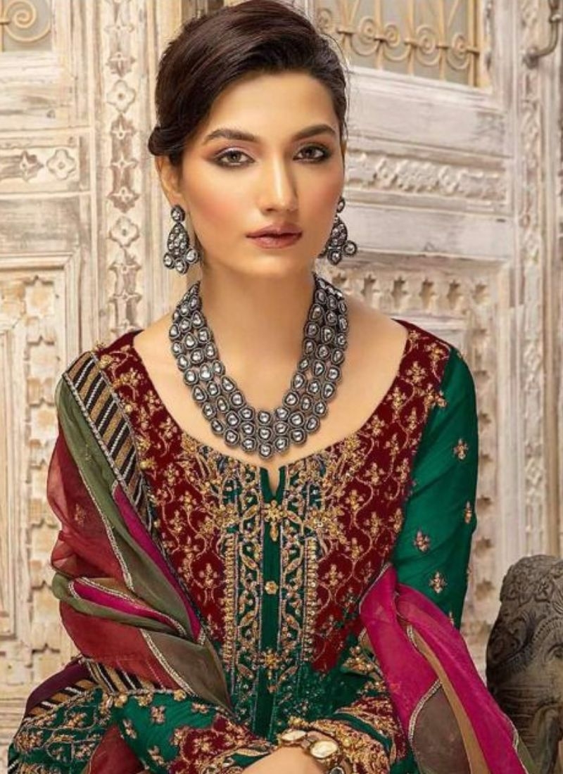 Beautiful embroidered georgette palazzo suit in dark green