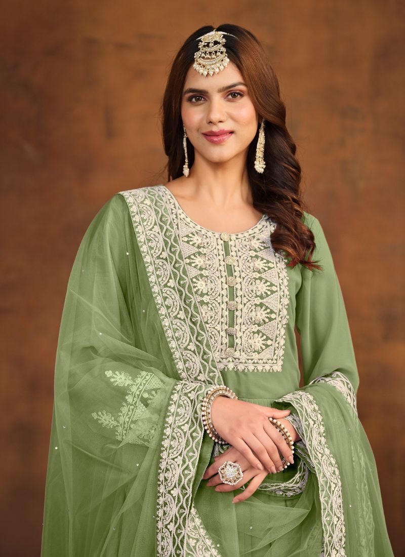 Beautiful embroidered faux georgette palazzo suit in green