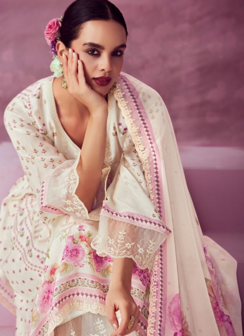 Beautiful embroidered pure muslin kurta pant suit in off white