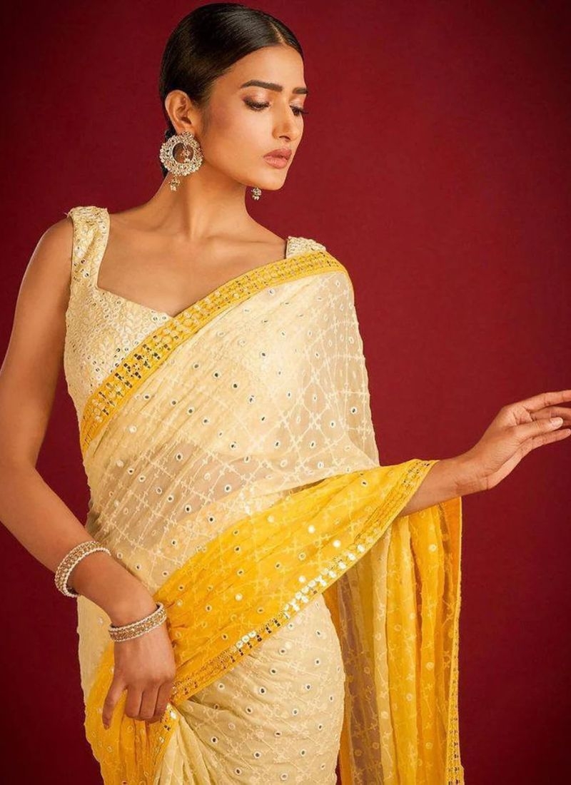 Beautifully embroidered soft georgette saree in yellow