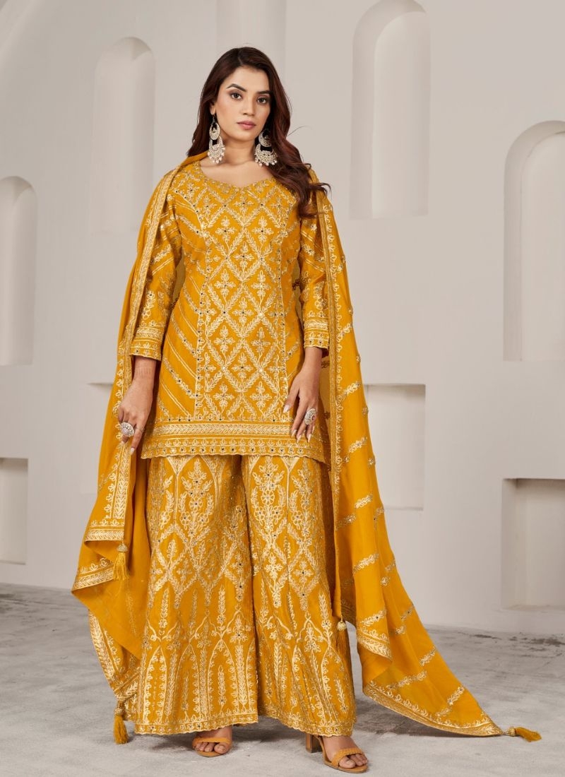 Exquisite heavy embroidered Chinon sharara suit in yellow