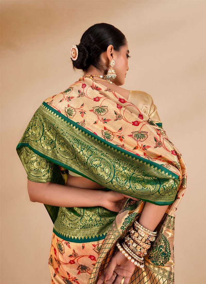 Stunning zari weaving tissue silk saree in green