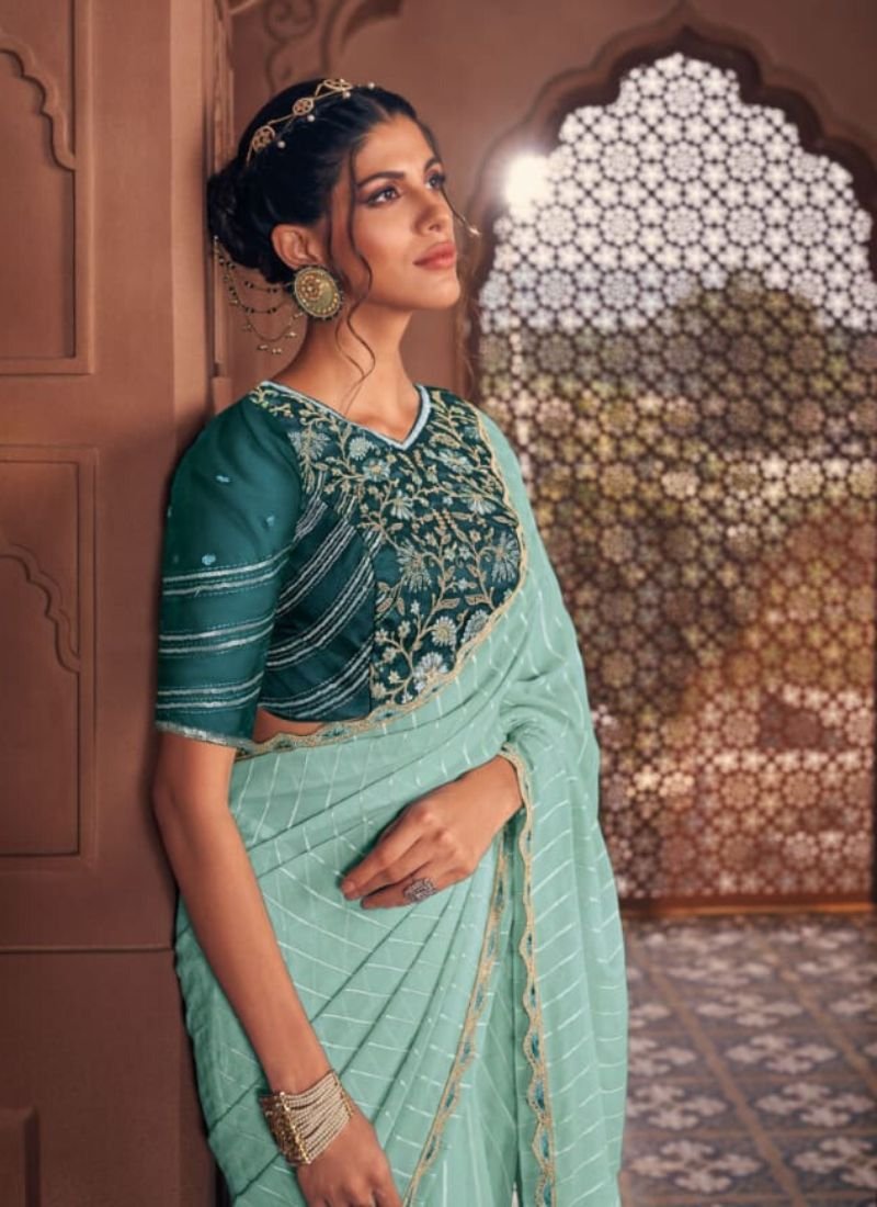 Stunning embroidered satin organza saree in teal green