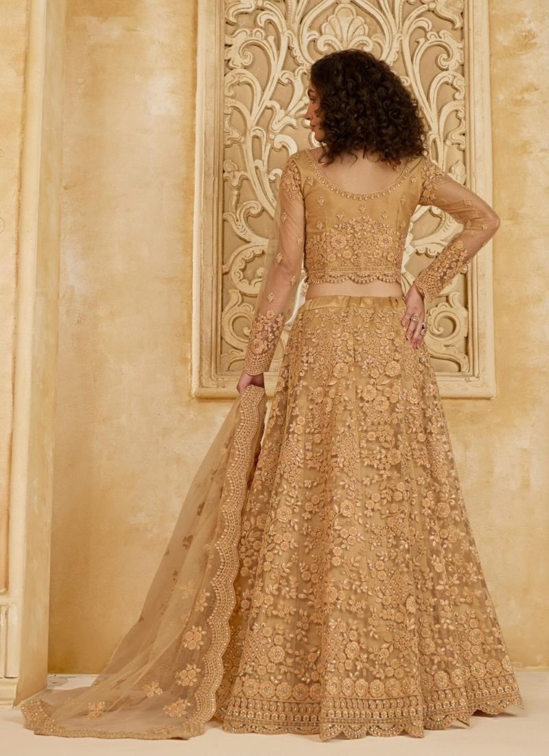 Trendy thread embroidered net lehenga in golden