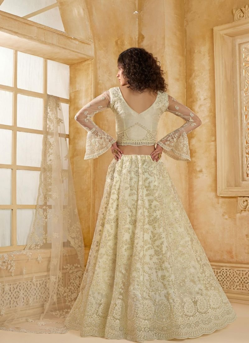 Trendy thread embroidered net lehenga in off white