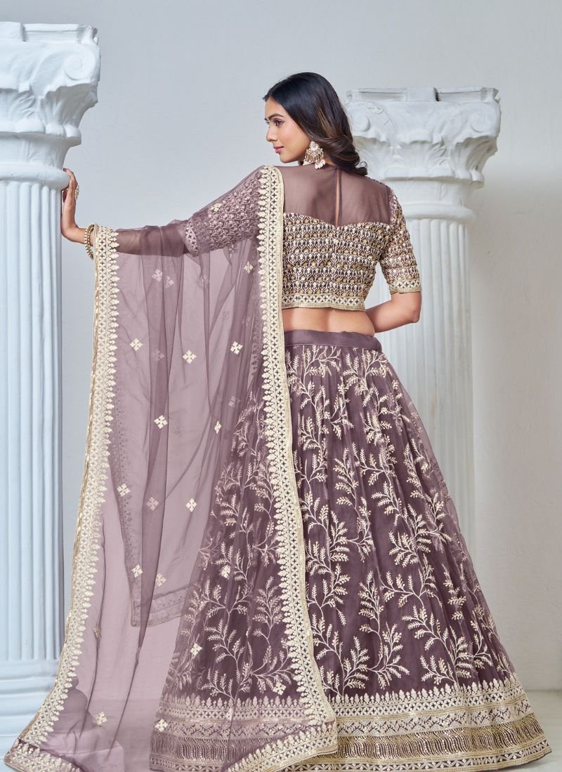 Exquisite heavy thread embroidered net lehenga choli in purple