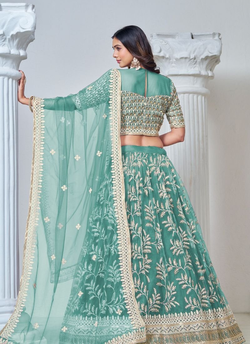 Exquisite heavy thread embroidered net lehenga choli in green