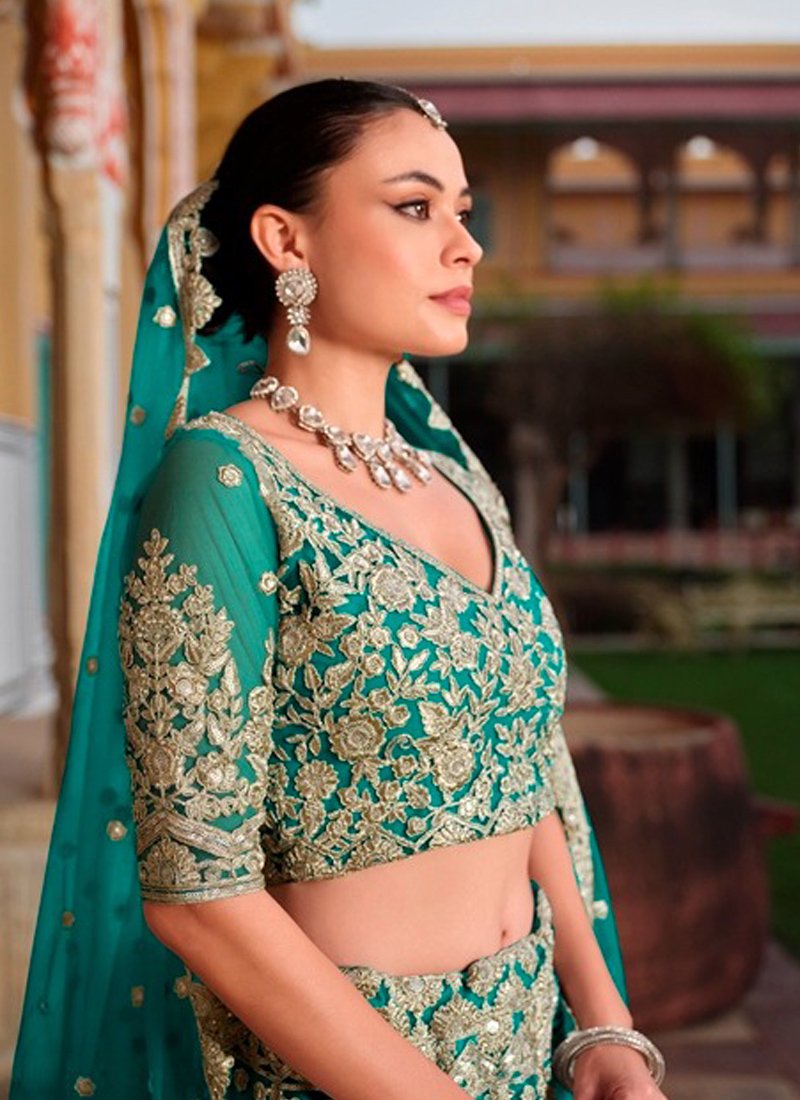 Beautiful bridal diamond embroidered butterfly net lehenga in dark green