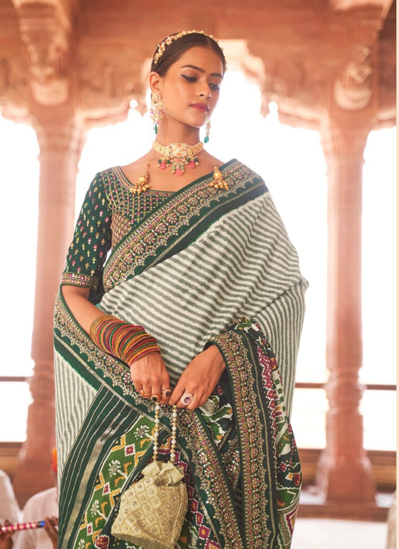 Traditional patola print saree with heavy embroidery in Green