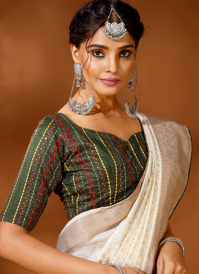 Traditional saree with jacquard border and thread embroidery in green