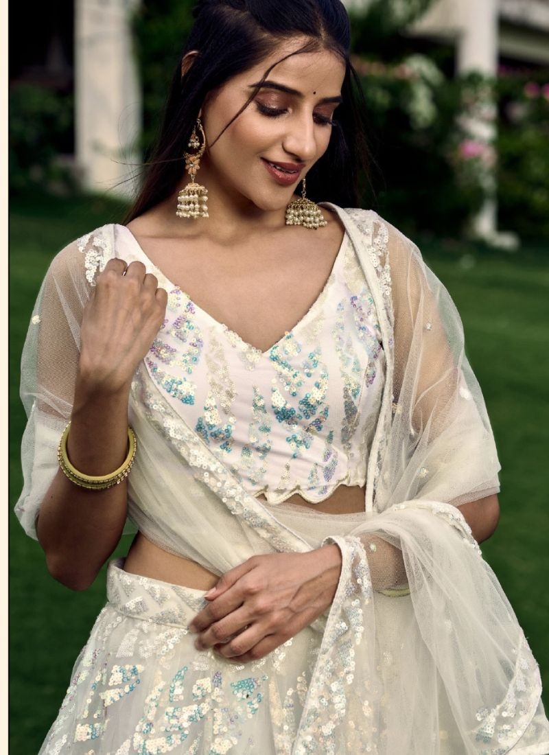 Heavy embroidered bridal lehenga in white