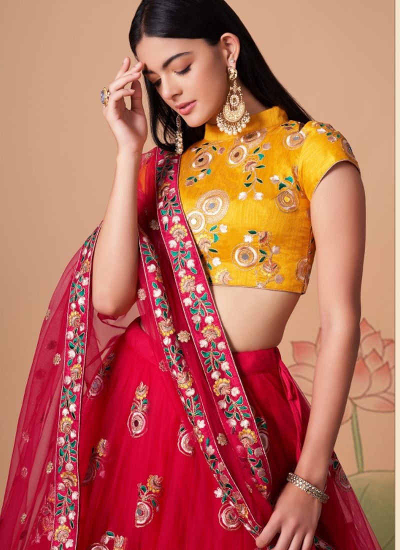 Soft net embroidered lehenga choli with mirror embroidery in red