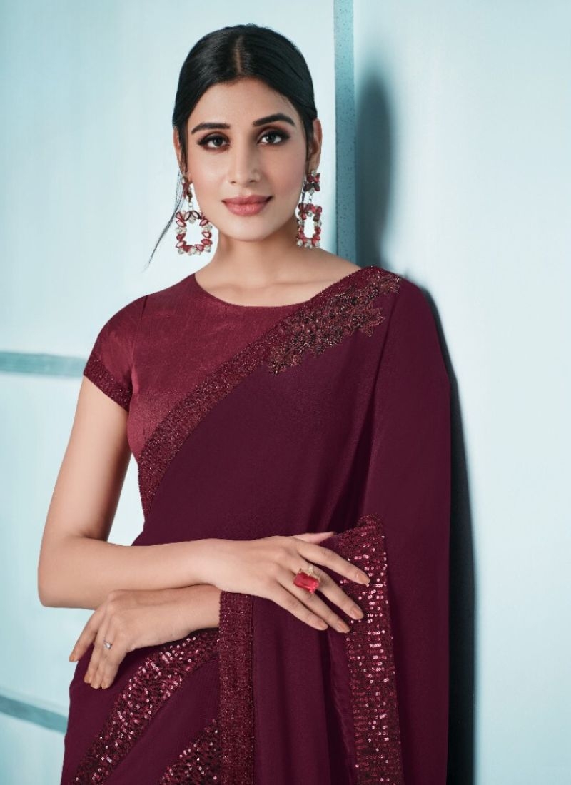 Exquisite wedding saree with embroidered blouse in maroon