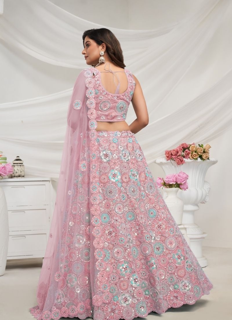 Stunning Sapphire Blue lehenga well crafted floral embellishments in light pink