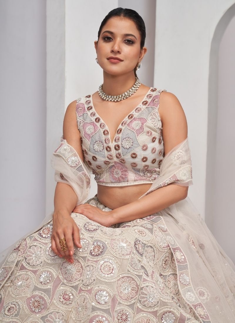 Dazzling White Lehenga: Blossoming Florals and classy Embellishments in perl white