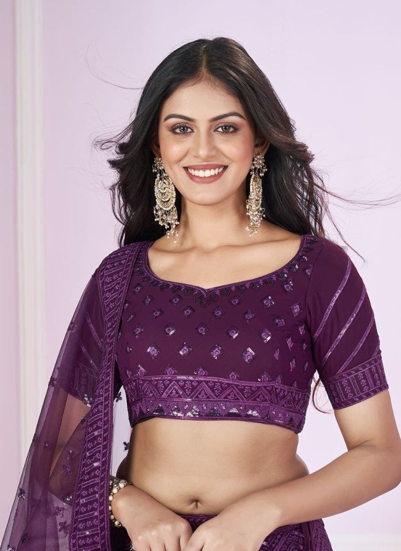 Exquisite embroidered georgette lehenga choli with net dupatta in dark violet