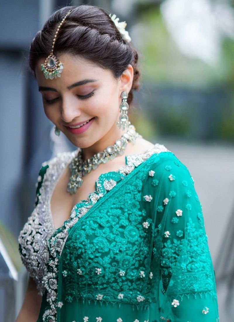 Beautiful embroidered butterfly net lehenga choli in dark green