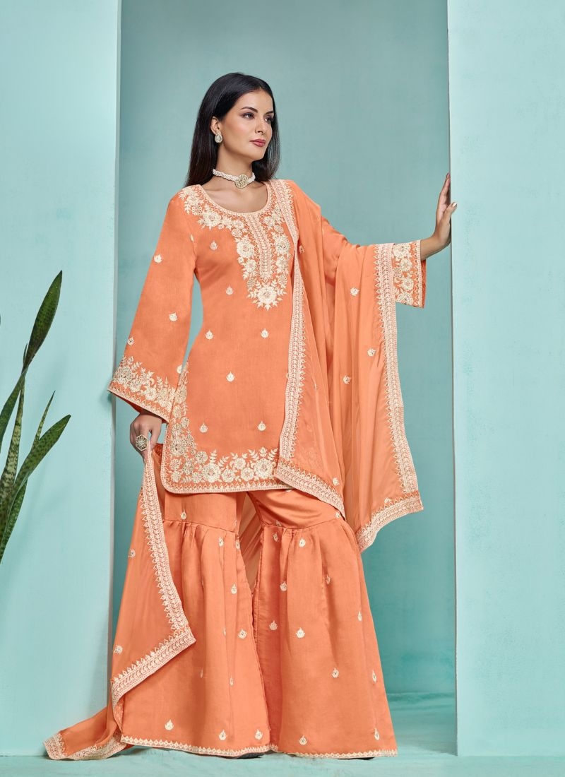 Stunning heavy embroidered sharara suit in orange