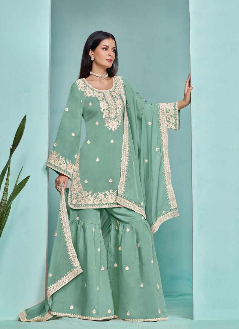 Stunning heavy embroidered sharara suit in green