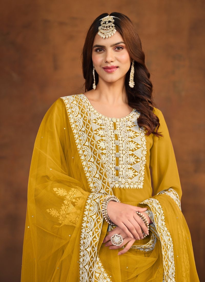 Beautiful embroidered faux georgette palazzo suit in yellow