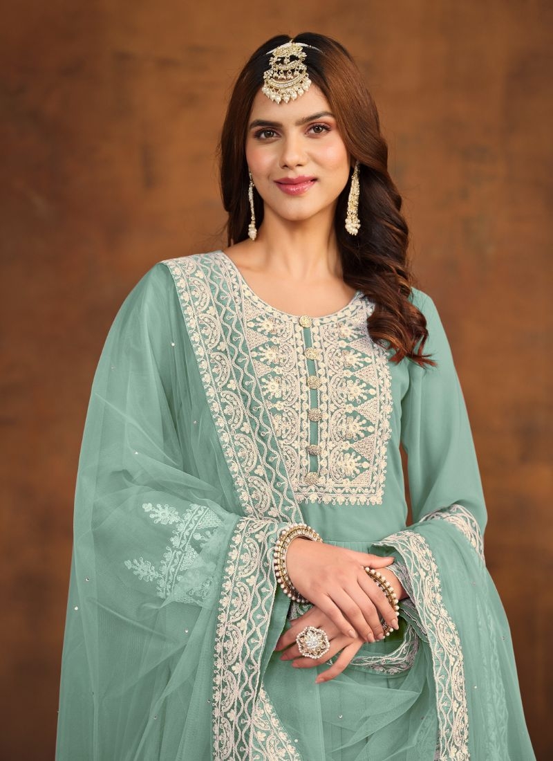 Beautiful embroidered faux georgette palazzo suit in sage green