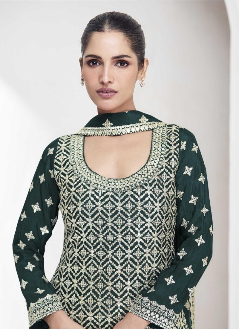 Exquisite thread embroidered sharara suit in dark green