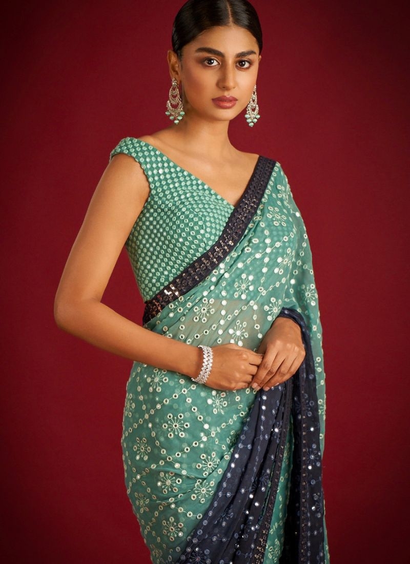 Beautifully embroidered soft georgette saree in green