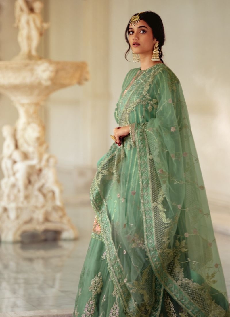 Designer patch embroidered georgette sharara suit in green