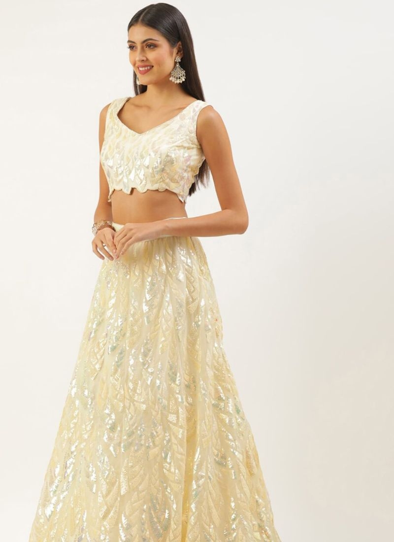 Exquisite multi-embroidered soft net lehenga choli in cream