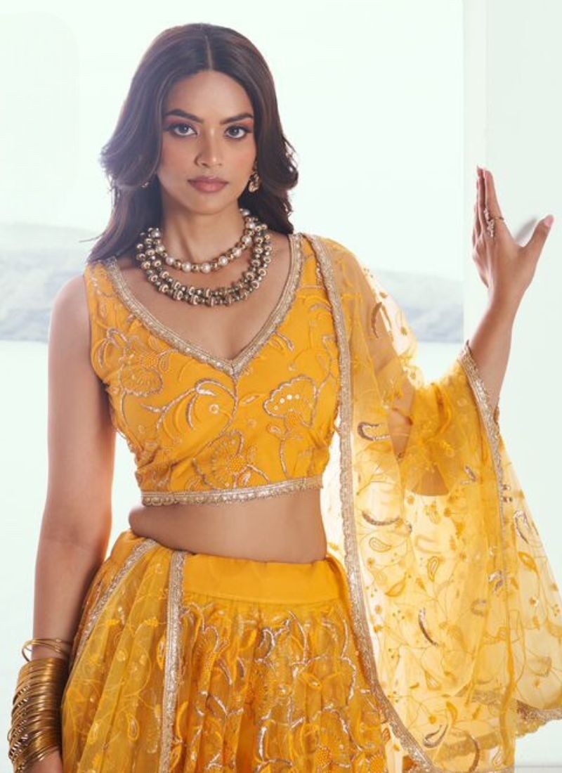 Beautiful designer butterfly net lehenga choli in yellow