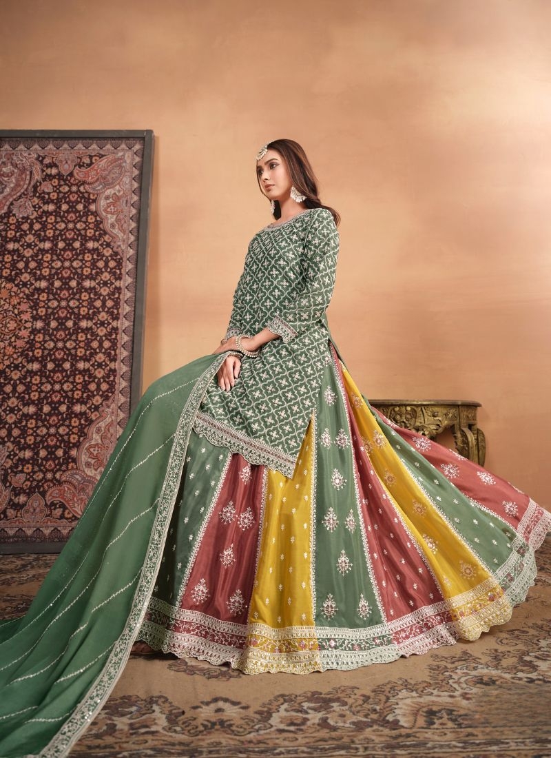 Beautiful heavy embroidered Chinon sharara suit in dark green