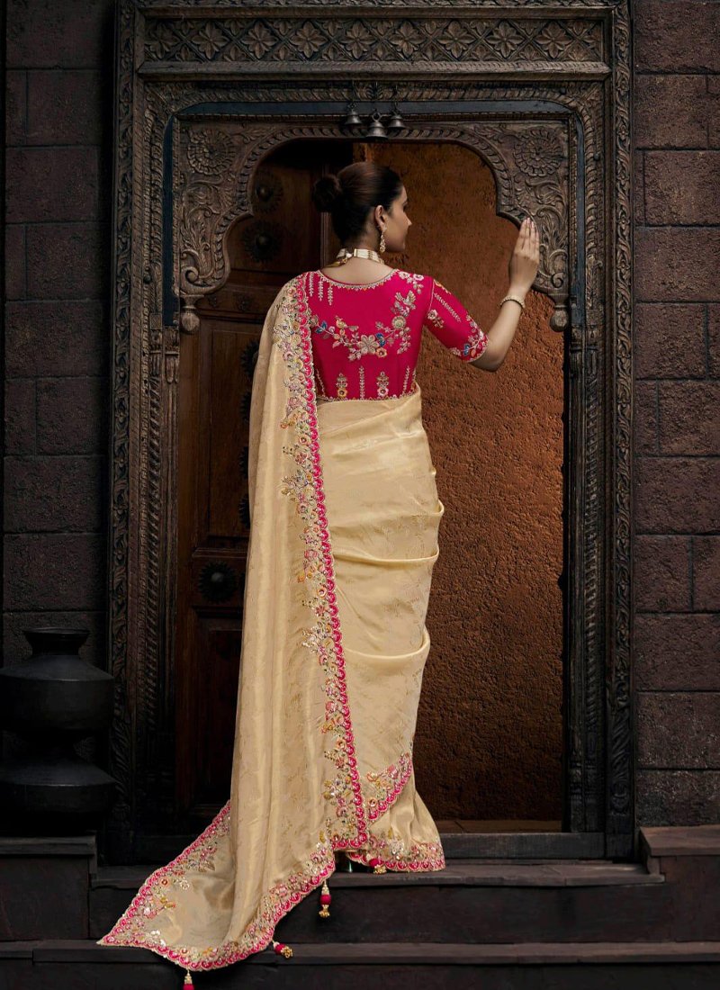 Designer zari embroidered viscose tissue saree in cream