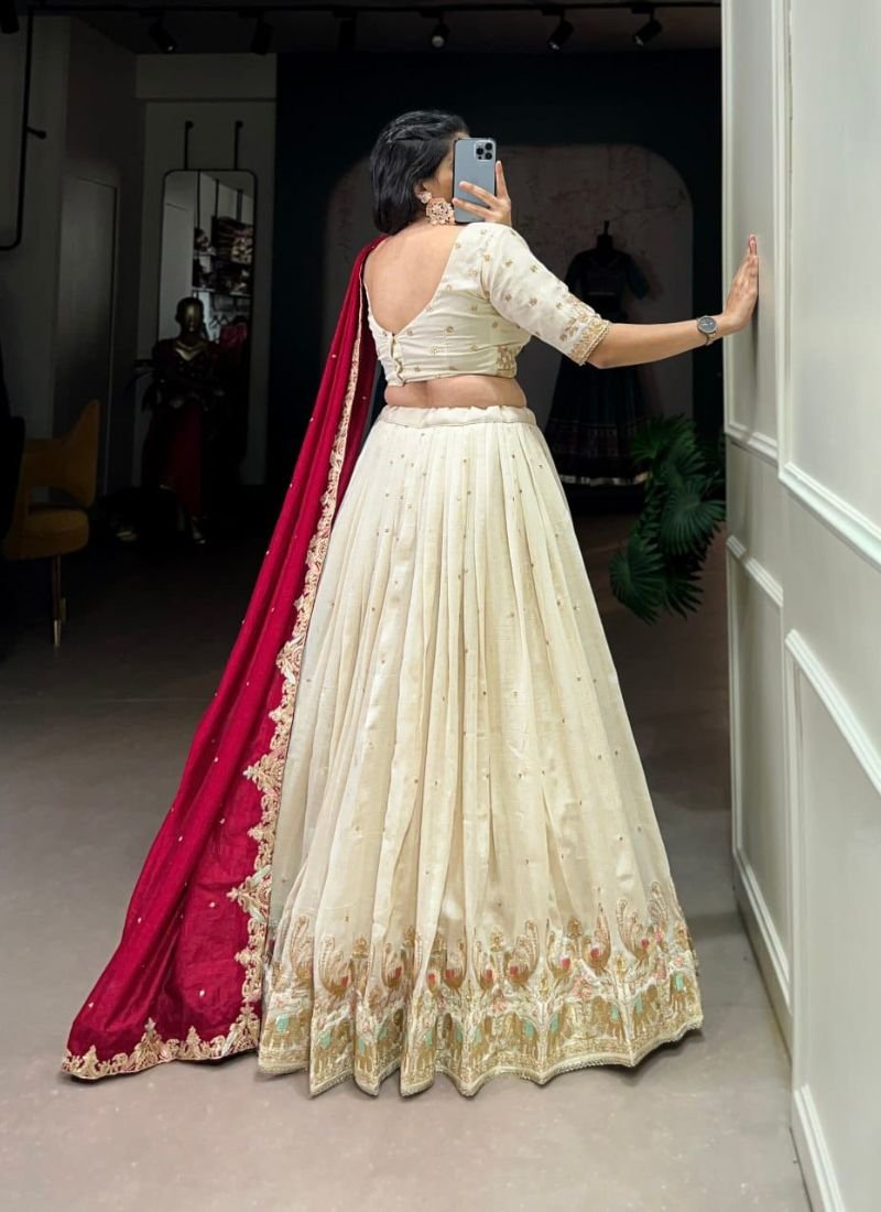 Exquisite thread embroidered silk lehenga in cream