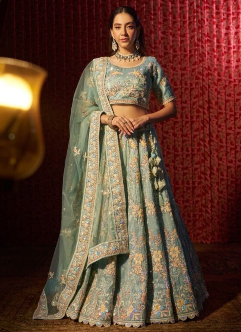 Stylish thread embroidered net lehenga choli in green