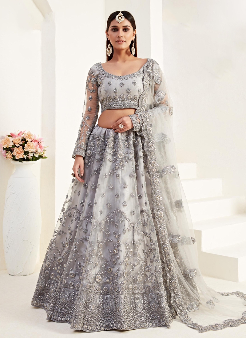 Heavy embroidered net lehenga in Grey