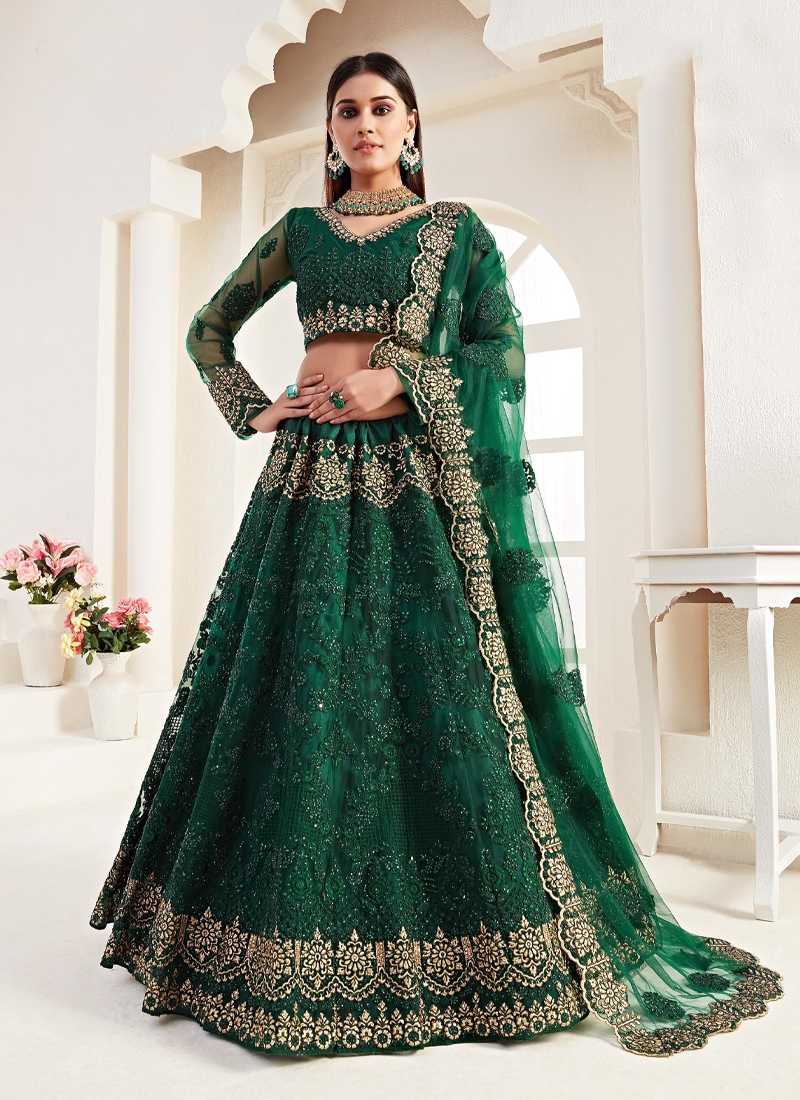 Heavy embroidered net lehenga in Green