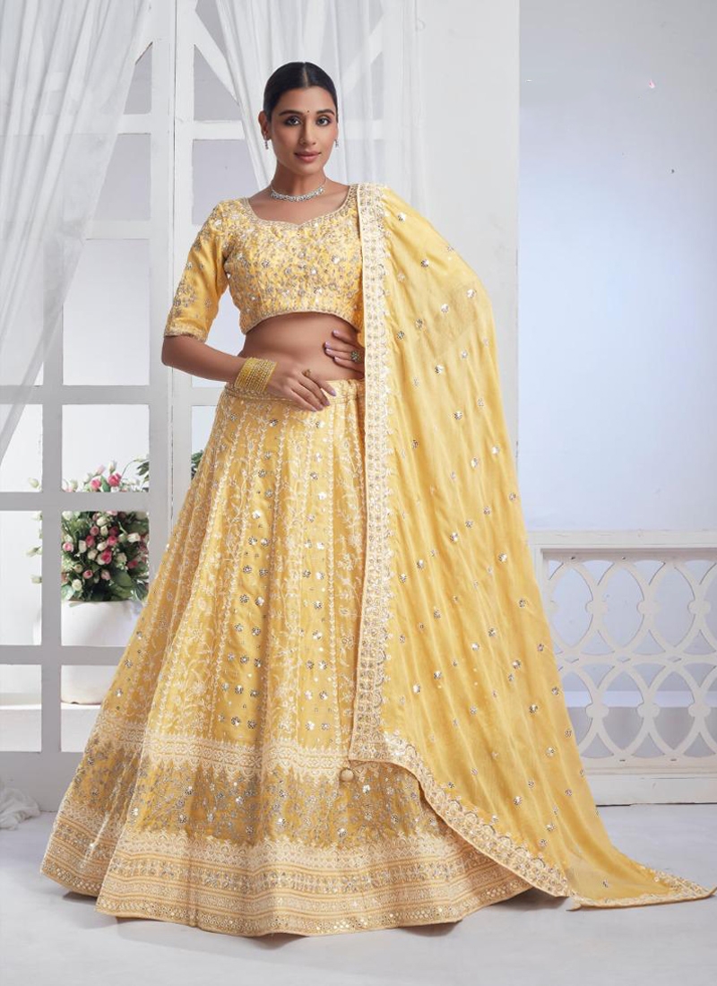 Designer soft netted lehenga with hand embroidery in Yellow