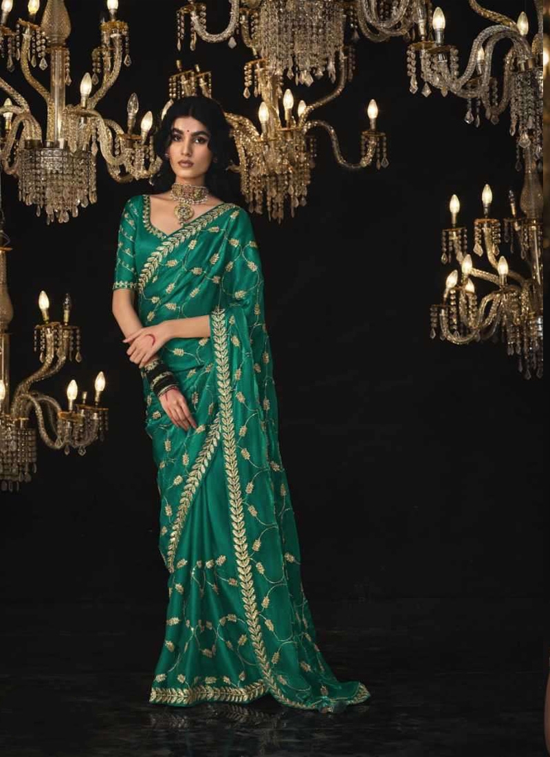 Pure silk saree with sequin, stone and zarkan work in Green