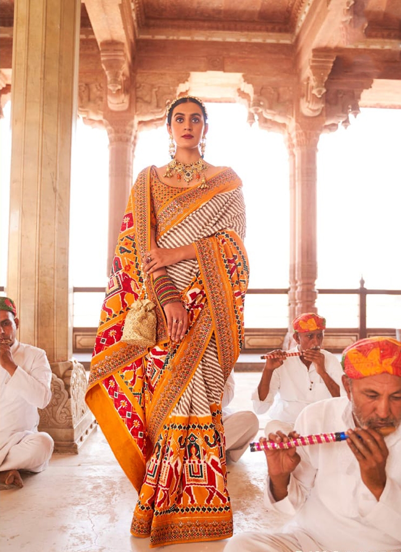 Traditional patola print saree with heavy embroidery in Yellow