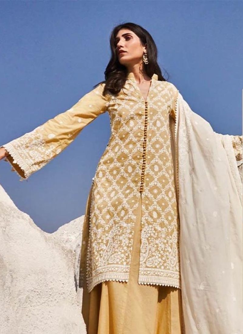 Exquisite cotton pant suit with mirror work in yellow