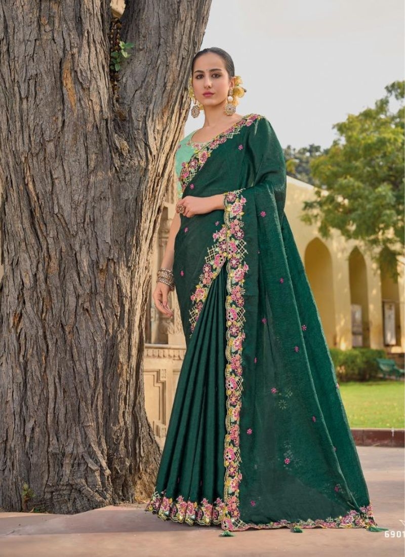 Beautiful organza silk saree with cut work in border in dark green