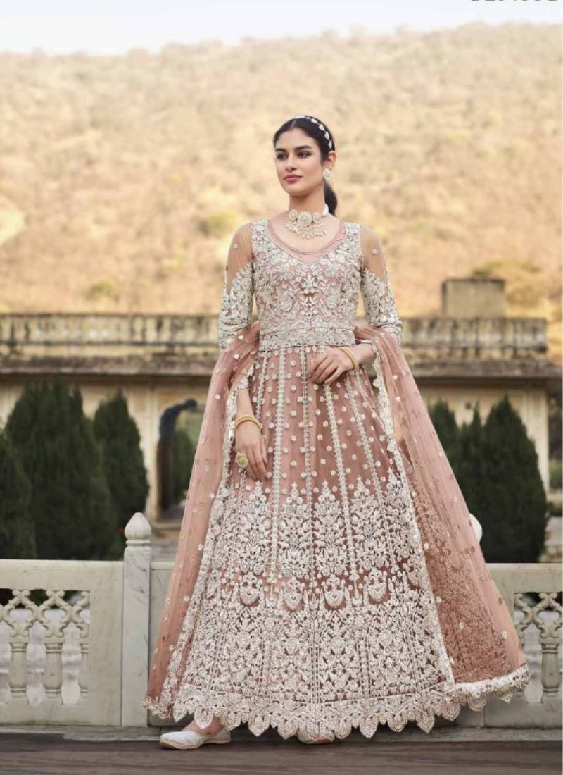 Beautiful butterfly net anarkali with stone work in peach