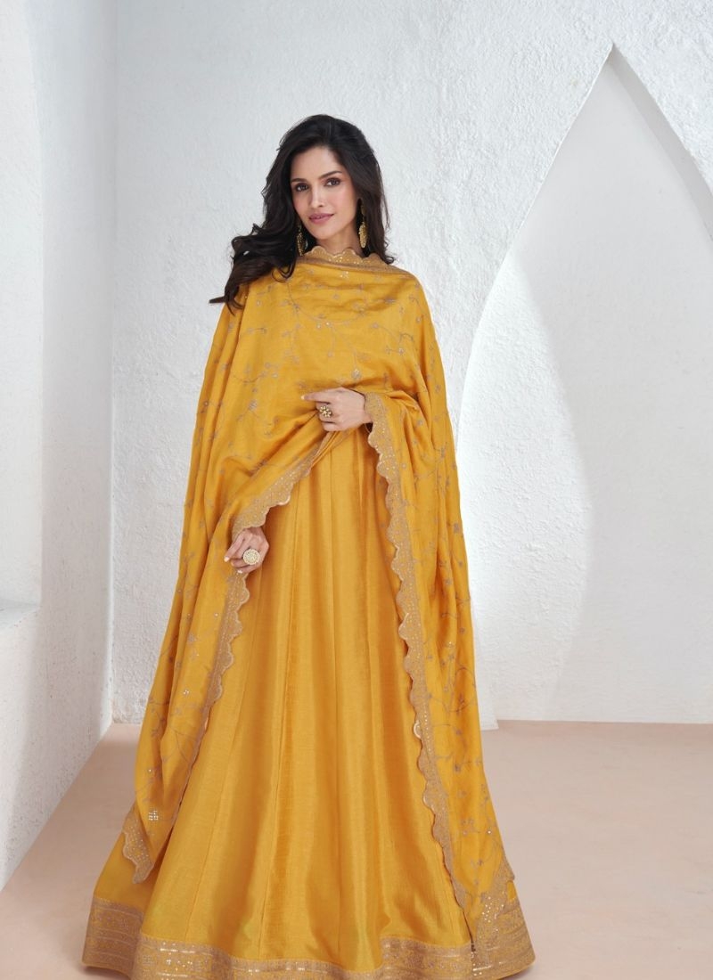 Beautiful silk anarkali suit with mirror work embroidery in yellow